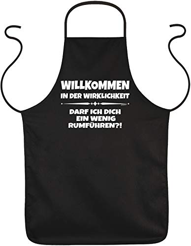 Art & Detail Shirt Kittel - Camiseta de manga corta, diseño con texto en alemán "Willkommen in der WirklichKeit kann ICH Dich rumführen?!" - Delantal con texto