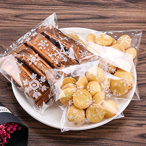 100pcs Bolsas de Celofan Navidad Bolsas para Chuches Autoadhesivo Copo de Nieve Bolsitas de Regalos de Dulces Transparente con Pegatinas Navidad para Confeti de Aperitivos Dulces Galletas